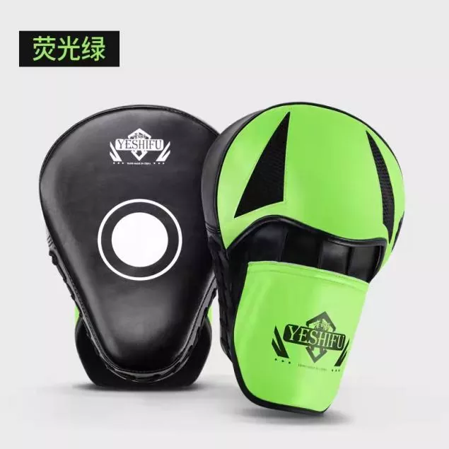 Focus mitts worn by coach for boxing punch drills